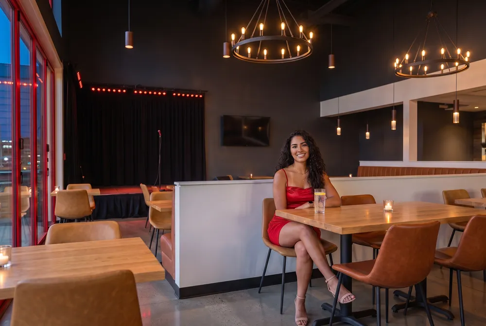 Woman in red at a table in The Well pub